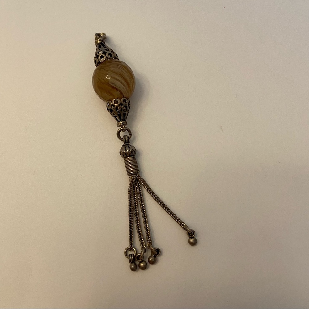 Gold swirl bead drop and tassel pendant